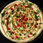 Creamy Hummus with Pine Nuts, Parsley, and Pomegranate