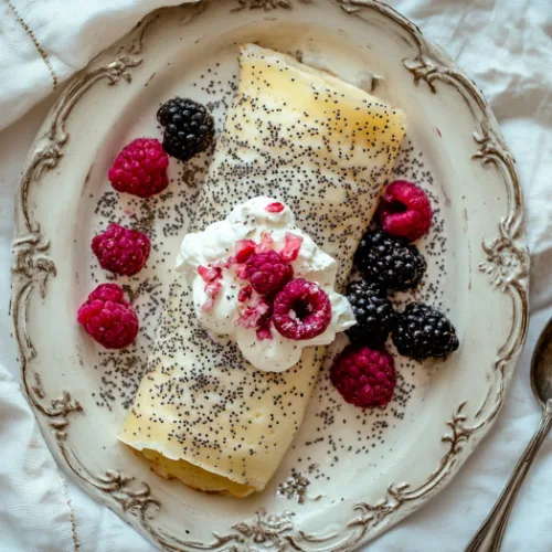 Poppy Seed Crêpes with Sweet Cream and Berries