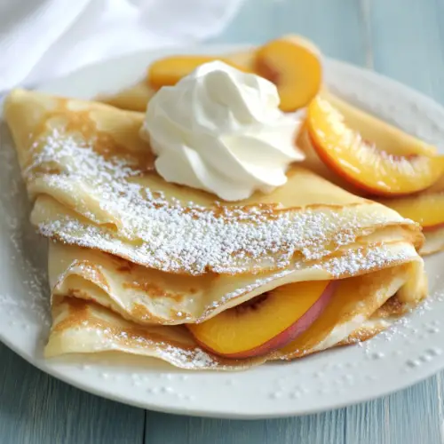 Peach-Filled Vanilla Crepes with Whipped Cream