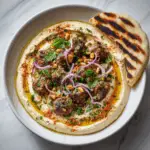 Hummus with Spiced Lamb, Pine Nuts & Grilled Flatbread