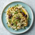 Roasted Cauliflower Steaks with Hummus, Feta & Olives