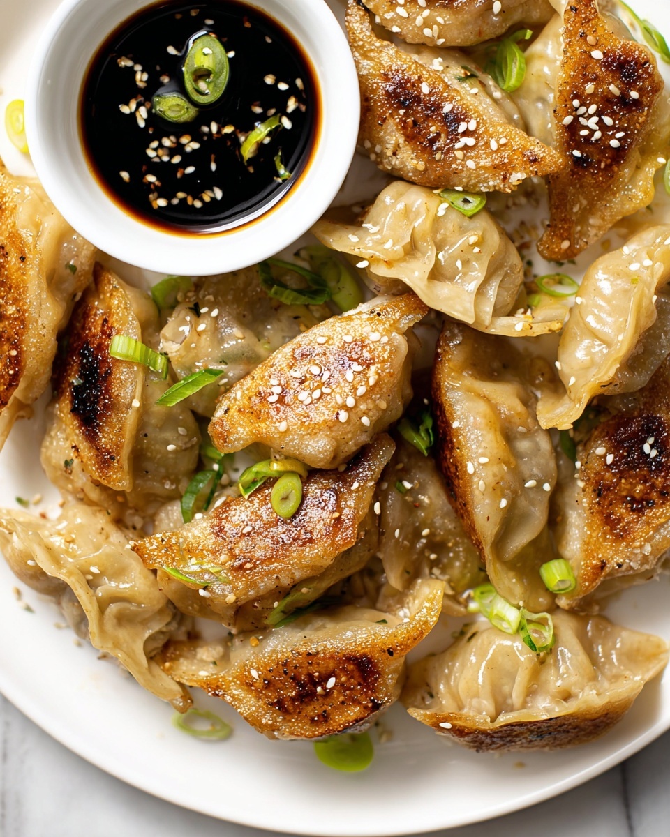 A white plate is filled with light golden brown dumplings, each dumpling showing a slightly wrinkled texture with some crispy, darker browned spots on top. The dumplings are sprinkled with white sesame seeds and small pieces of green onion scattered on and around them. At the bottom of the image, there is a small white bowl filled with dark soy sauce, with slices of green onion floating on the surface. The plate sits on a white marbled surface. The photo taken with an iphone --ar 4:5 --v 7