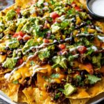 Oven-Baked Nachos with Ground Beef, Vegetables, and Melted Cheese Recipe