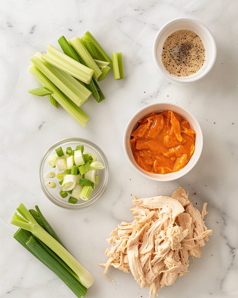 Single white bowl containing a close-up serving of creamy chicken salad with visible chunks of tender chicken, diced celery, and chopped green onions on top, showcasing the mixed textures of smooth dressing and crisp vegetables, placed on a white marble surface with natural lighting emphasizing freshness, styled as a ready-to-eat portion photo taken with an iphone --ar 4:5 --v 7