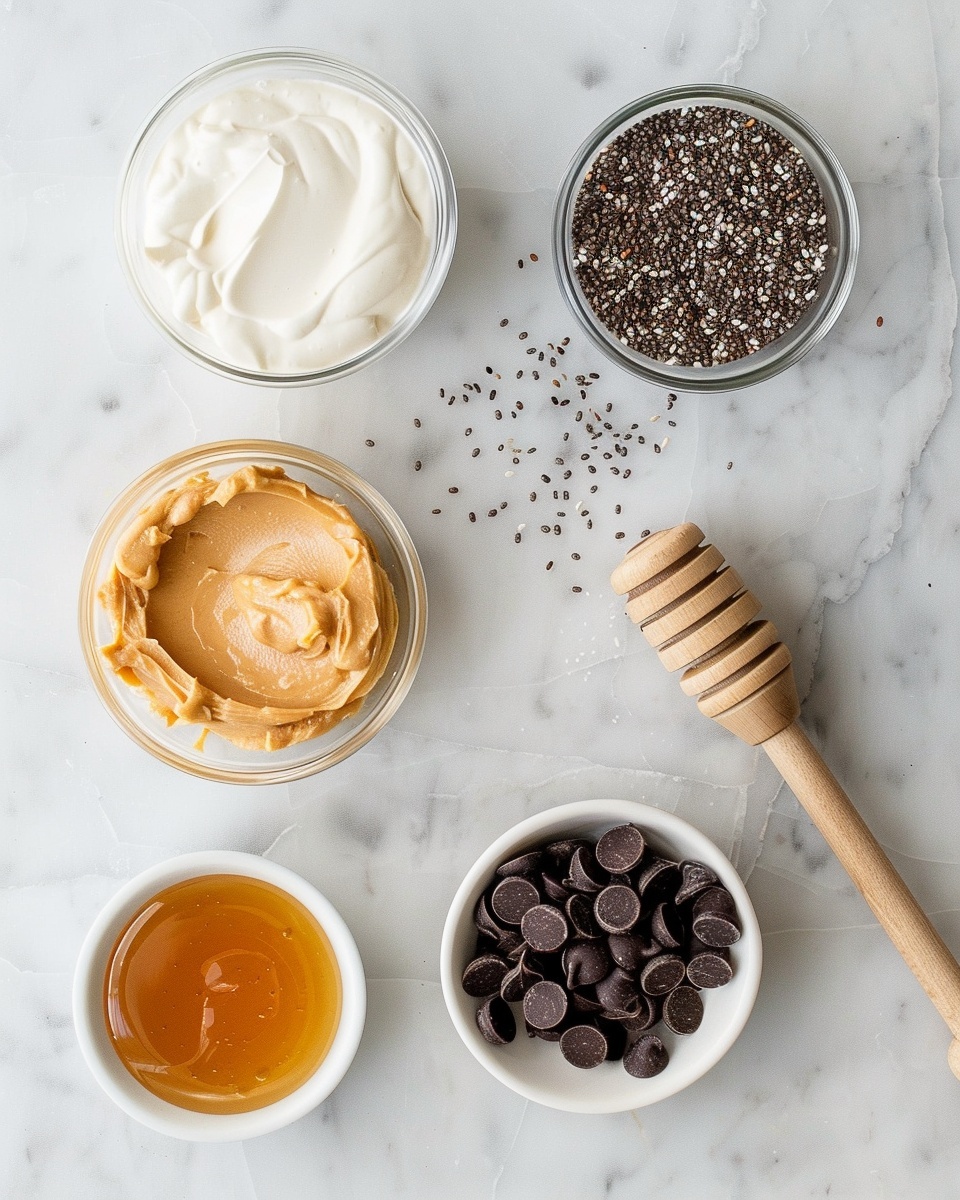 Single white bowl showcasing a generous serving of chocolate chip cookie dough with visible chunks of semi-sweet chocolate chips and a few blue candy-coated chocolates scattered on top, close-up angle emphasizing the soft texture and slightly glossy surface, placed on white marble background, natural lighting highlighting the rich color contrast, styled as a ready-to-eat individual portion, photo taken with an iphone --ar 4:5 --v 7