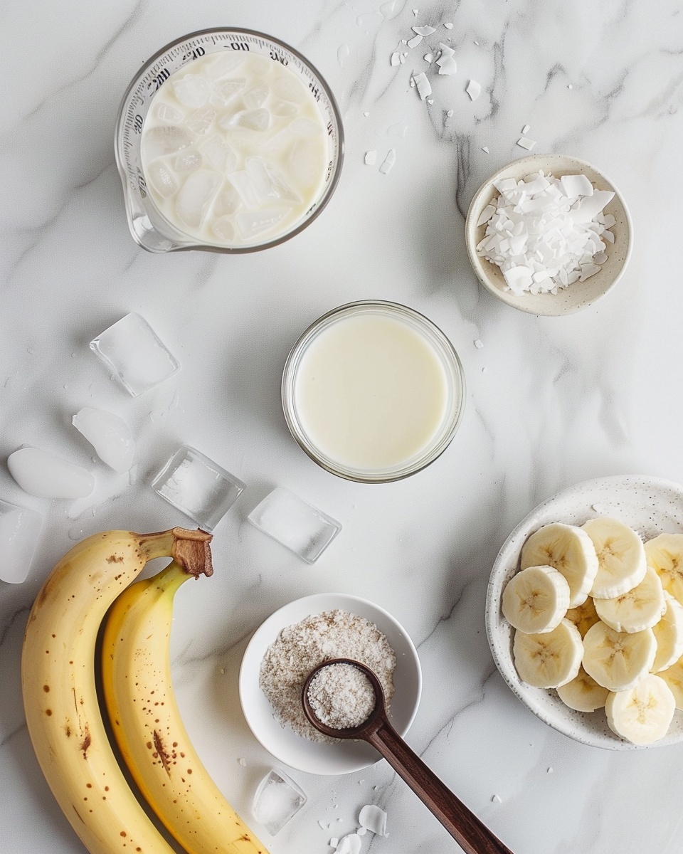 Vegan Paleo AIP Banana Milkshake Recipe 5 Single white glass filled with one generous serving of creamy banana smoothie topped with toasted coconut flakes, a visible frothy texture on the surface, and a caramelized banana slice perched on the rim, placed on white marble background with a natural light enhancing the smooth, rich layers, intimate plated serving photo taken with an iphone --ar 4:5 --v 7