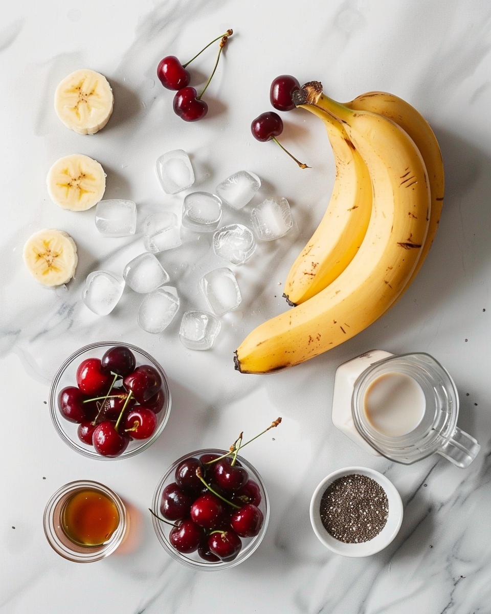 Single white glass filled with one serving of thick pink cherry and banana smoothie topped with chia seeds, close-up view highlighting the creamy texture and tiny fruit bits, white straw inserted, placed on a white marble surface with scattered fresh cherries and banana slices out of focus in the background, natural lighting, styled like a food blog photo taken with an iphone --ar 4:5 --v 7