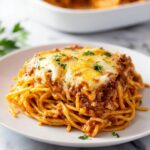 Spaghetti Pie with Ricotta, Meat Sauce, and Melting Mozzarella Recipe